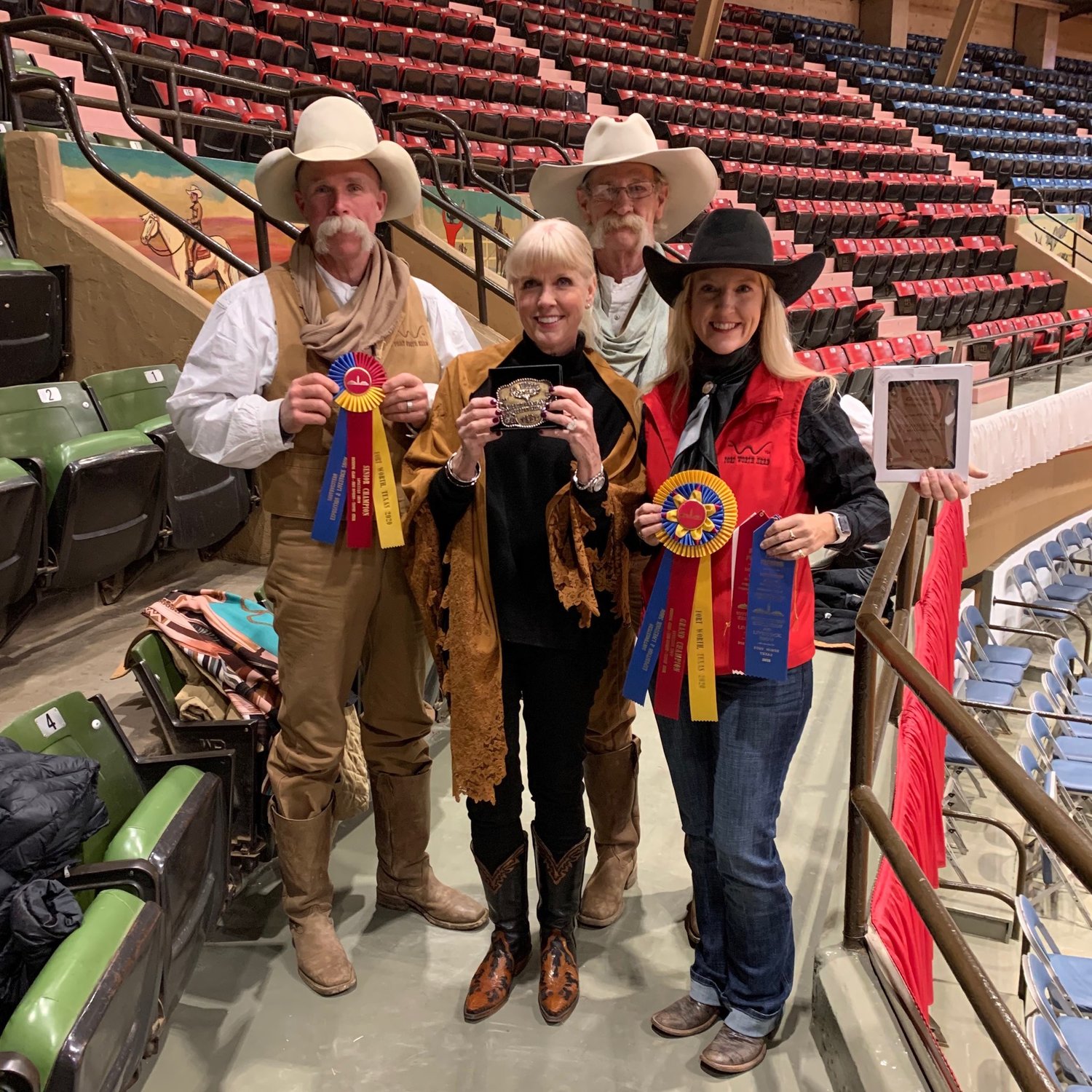 From left, David Mangold, herd drover; Rebecca Wampler, steer donor; Daryl Border, herd drover; and Kristin Jaworski, herd trail boss with the longhorn trophies.